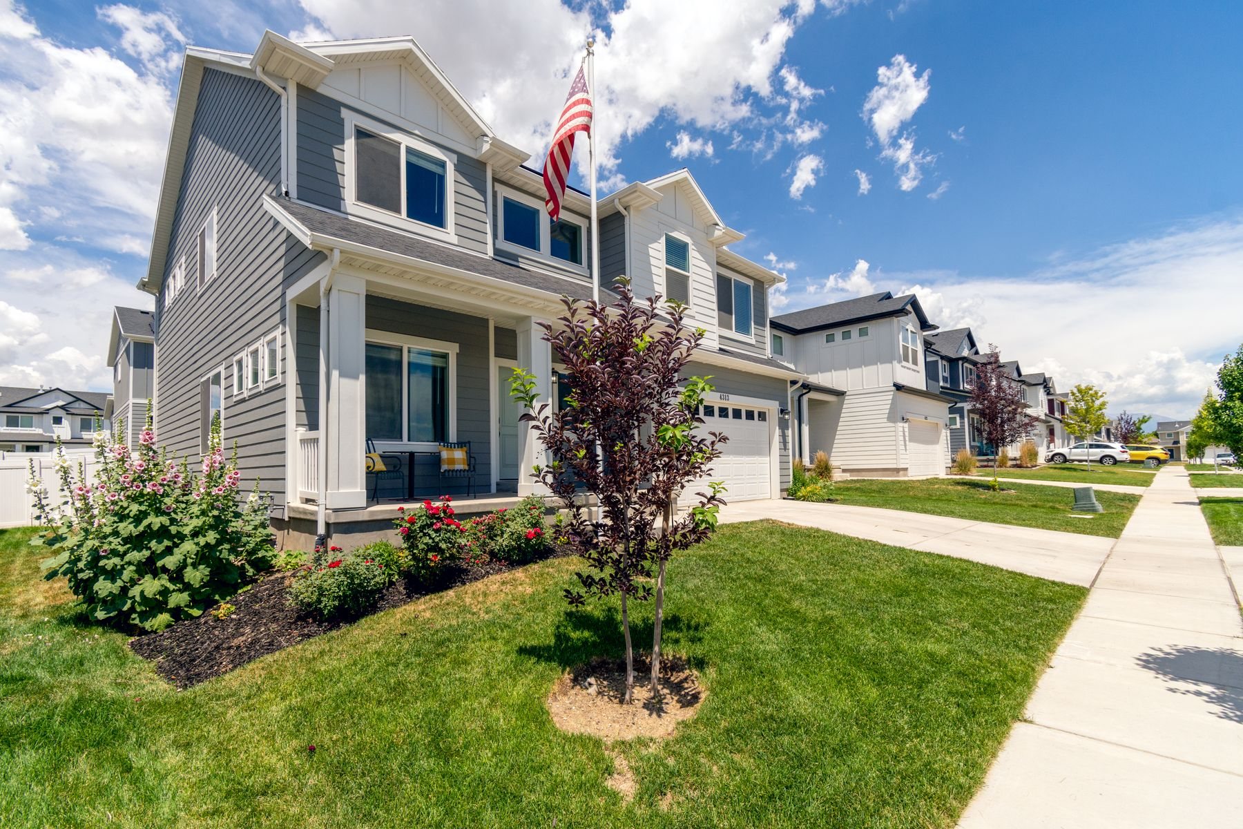 Two story homes on a Utah street, illustrative